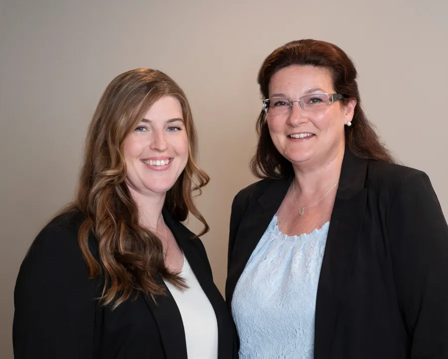 Two members of the Gianno & Freda staff